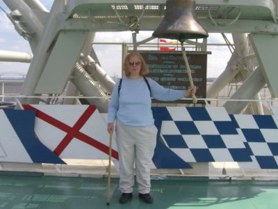 Madeline Feltus with ship's bell